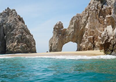 brown rock formation on sea during daytime